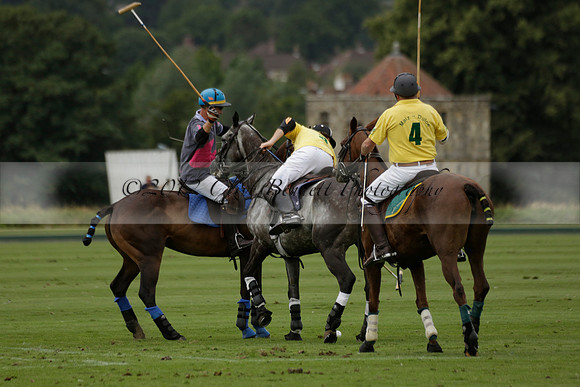 La Tremenda (lilac) v Maiz Dulce (yellow) in a Brecknock Cup polo match played on Lawns 1 at the Cowdray Park Polo Club on Tuesday 13 August 2013