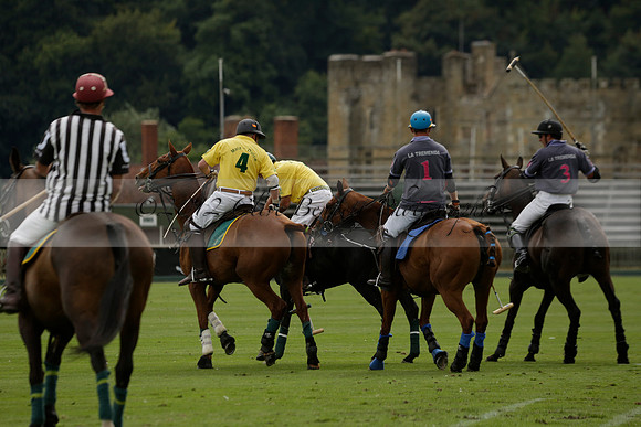 La Tremenda (lilac) v Maiz Dulce (yellow) in a Brecknock Cup polo match played on Lawns 1 at the Cowdray Park Polo Club on Tuesday 13 August 2013