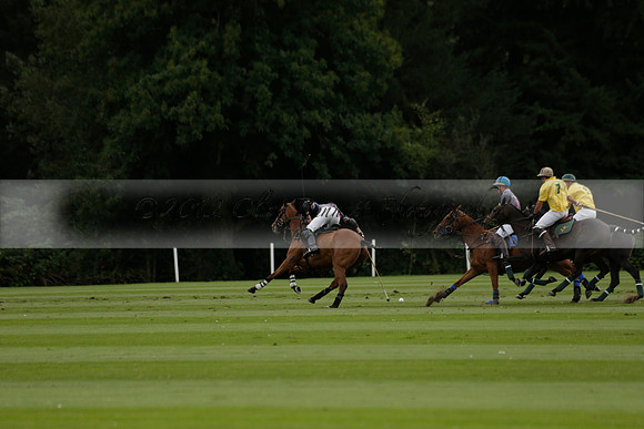 La Tremenda (lilac) v Maiz Dulce (yellow) in a Brecknock Cup polo match played on Lawns 1 at the Cowdray Park Polo Club on Tuesday 13 August 2013