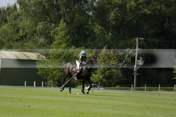 Maiz Dulce (green) v River (blue) in a Uber Polo Midsummer 12 goal polo match on Wednesday 21 August 2013 at Cowdray park Polo Club on Ambersham 2.  www.polopictures.co.uk