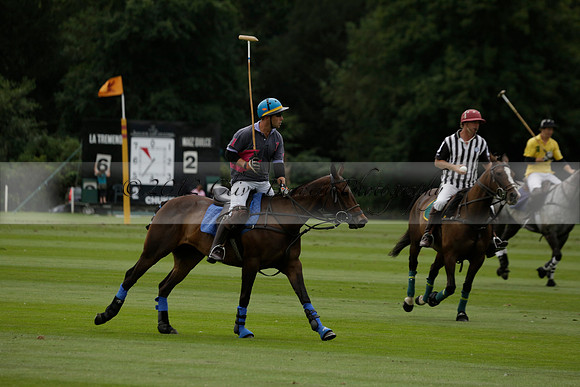 La Tremenda (lilac) v Maiz Dulce (yellow) in a Brecknock Cup polo match played on Lawns 1 at the Cowdray Park Polo Club on Tuesday 13 August 2013