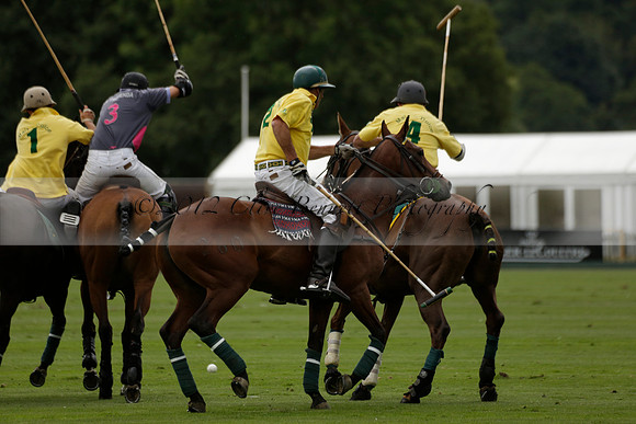 La Tremenda (lilac) v Maiz Dulce (yellow) in a Brecknock Cup polo match played on Lawns 1 at the Cowdray Park Polo Club on Tuesday 13 August 2013