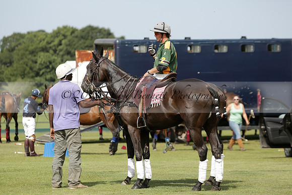 Maiz Dulce (green) v River (blue) in a Uber Polo Midsummer 12 goal polo match on Wednesday 21 August 2013 at Cowdray park Polo Club on Ambersham 2.  www.polopictures.co.uk