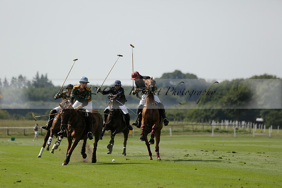 Maiz Dulce (green) v River (blue) in a Uber Polo Midsummer 12 goal polo match on Wednesday 21 August 2013 at Cowdray park Polo Club on Ambersham 2.  www.polopictures.co.uk