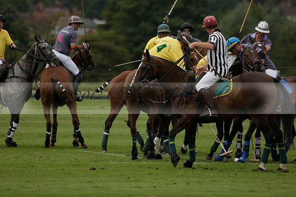La Tremenda (lilac) v Maiz Dulce (yellow) in a Brecknock Cup polo match played on Lawns 1 at the Cowdray Park Polo Club on Tuesday 13 August 2013