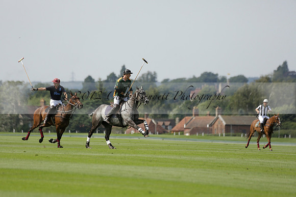 Maiz Dulce (green) v River (blue) in a Uber Polo Midsummer 12 goal polo match on Wednesday 21 August 2013 at Cowdray park Polo Club on Ambersham 2.  www.polopictures.co.uk