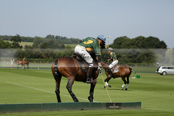 Maiz Dulce (green) v River (blue) in a Uber Polo Midsummer 12 goal polo match on Wednesday 21 August 2013 at Cowdray park Polo Club on Ambersham 2.  www.polopictures.co.uk