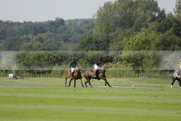 Maiz Dulce (green) v River (blue) in a Uber Polo Midsummer 12 goal polo match on Wednesday 21 August 2013 at Cowdray park Polo Club on Ambersham 2.  www.polopictures.co.uk