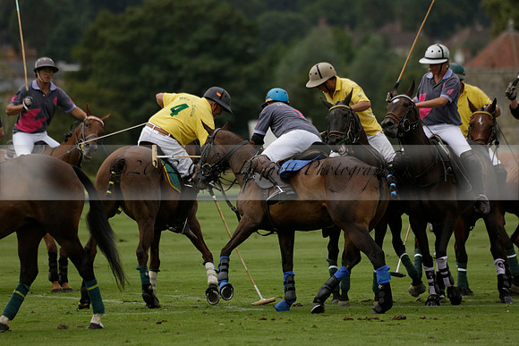 La Tremenda (lilac) v Maiz Dulce (yellow) in a Brecknock Cup polo match played on Lawns 1 at the Cowdray Park Polo Club on Tuesday 13 August 2013