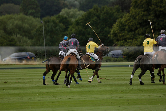 La Tremenda (lilac) v Maiz Dulce (yellow) in a Brecknock Cup polo match played on Lawns 1 at the Cowdray Park Polo Club on Tuesday 13 August 2013