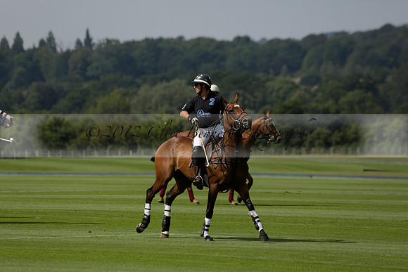 Maiz Dulce (green) v River (blue) in a Uber Polo Midsummer 12 goal polo match on Wednesday 21 August 2013 at Cowdray park Polo Club on Ambersham 2.  www.polopictures.co.uk