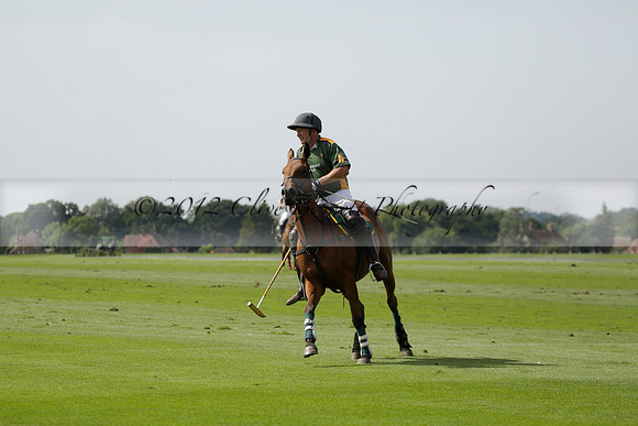Maiz Dulce (green) v River (blue) in a Uber Polo Midsummer 12 goal polo match on Wednesday 21 August 2013 at Cowdray park Polo Club on Ambersham 2.  www.polopictures.co.uk