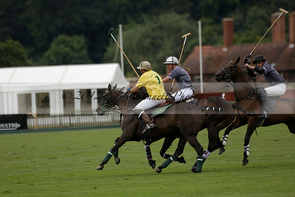 La Tremenda (lilac) v Maiz Dulce (yellow) in a Brecknock Cup polo match played on Lawns 1 at the Cowdray Park Polo Club on Tuesday 13 August 2013