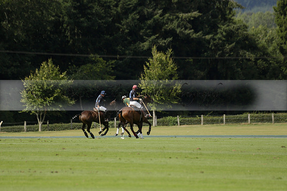Maiz Dulce (green) v River (blue) in a Uber Polo Midsummer 12 goal polo match on Wednesday 21 August 2013 at Cowdray park Polo Club on Ambersham 2.  www.polopictures.co.uk