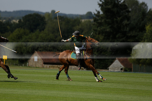 Maiz Dulce (green) v River (blue) in a Uber Polo Midsummer 12 goal polo match on Wednesday 21 August 2013 at Cowdray park Polo Club on Ambersham 2.  www.polopictures.co.uk