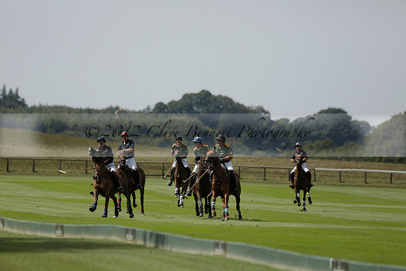 Maiz Dulce (green) v River (blue) in a Uber Polo Midsummer 12 goal polo match on Wednesday 21 August 2013 at Cowdray park Polo Club on Ambersham 2.  www.polopictures.co.uk
