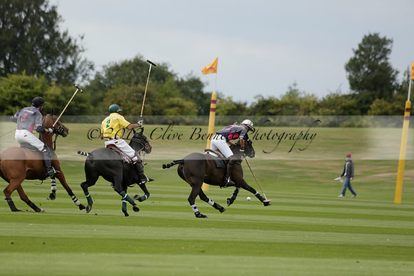 La Tremenda (lilac) v Maiz Dulce (yellow) in a Brecknock Cup polo match played on Lawns 1 at the Cowdray Park Polo Club on Tuesday 13 August 2013