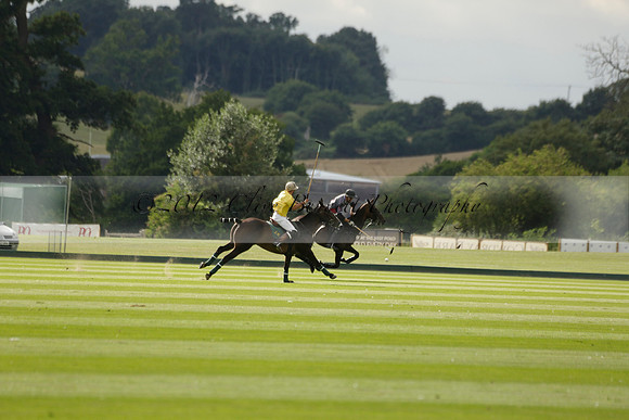 La Tremenda (lilac) v Maiz Dulce (yellow) in a Brecknock Cup polo match played on Lawns 1 at the Cowdray Park Polo Club on Tuesday 13 August 2013