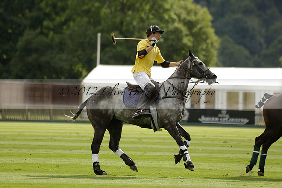 La Tremenda (lilac) v Maiz Dulce (yellow) in a Brecknock Cup polo match played on Lawns 1 at the Cowdray Park Polo Club on Tuesday 13 August 2013