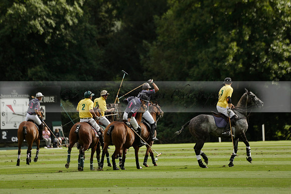 La Tremenda (lilac) v Maiz Dulce (yellow) in a Brecknock Cup polo match played on Lawns 1 at the Cowdray Park Polo Club on Tuesday 13 August 2013