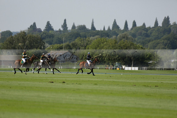Maiz Dulce (green) v River (blue) in a Uber Polo Midsummer 12 goal polo match on Wednesday 21 August 2013 at Cowdray park Polo Club on Ambersham 2.  www.polopictures.co.uk