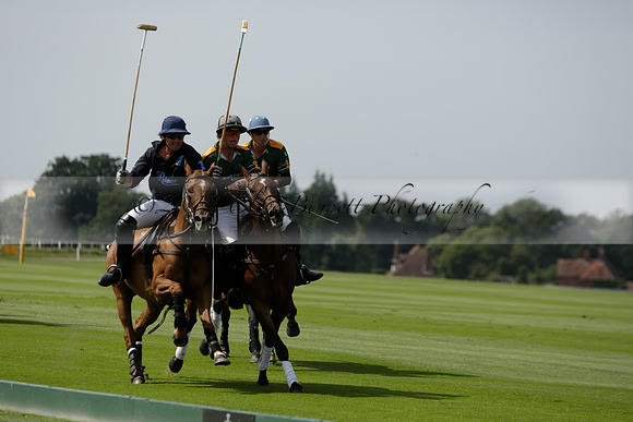 Maiz Dulce (green) v River (blue) in a Uber Polo Midsummer 12 goal polo match on Wednesday 21 August 2013 at Cowdray park Polo Club on Ambersham 2.  www.polopictures.co.uk