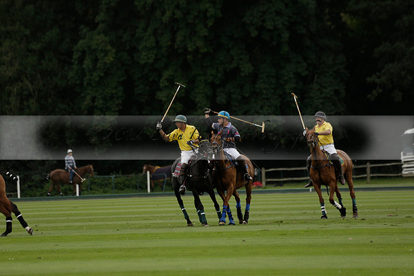 La Tremenda (lilac) v Maiz Dulce (yellow) in a Brecknock Cup polo match played on Lawns 1 at the Cowdray Park Polo Club on Tuesday 13 August 2013