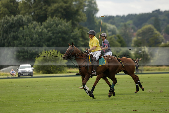 La Tremenda (lilac) v Maiz Dulce (yellow) in a Brecknock Cup polo match played on Lawns 1 at the Cowdray Park Polo Club on Tuesday 13 August 2013