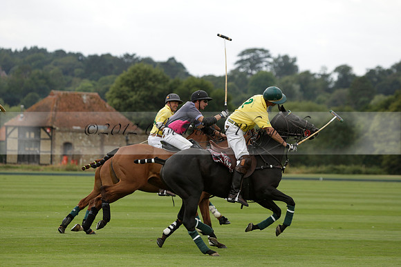 La Tremenda (lilac) v Maiz Dulce (yellow) in a Brecknock Cup polo match played on Lawns 1 at the Cowdray Park Polo Club on Tuesday 13 August 2013