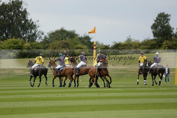 La Tremenda (lilac) v Maiz Dulce (yellow) in a Brecknock Cup polo match played on Lawns 1 at the Cowdray Park Polo Club on Tuesday 13 August 2013