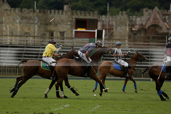 La Tremenda (lilac) v Maiz Dulce (yellow) in a Brecknock Cup polo match played on Lawns 1 at the Cowdray Park Polo Club on Tuesday 13 August 2013