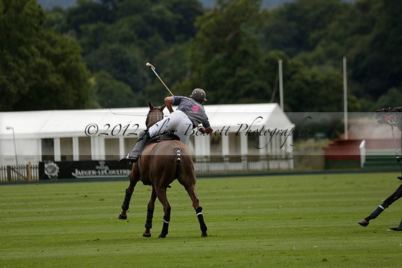 La Tremenda (lilac) v Maiz Dulce (yellow) in a Brecknock Cup polo match played on Lawns 1 at the Cowdray Park Polo Club on Tuesday 13 August 2013