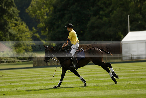 La Tremenda (lilac) v Maiz Dulce (yellow) in a Brecknock Cup polo match played on Lawns 1 at the Cowdray Park Polo Club on Tuesday 13 August 2013