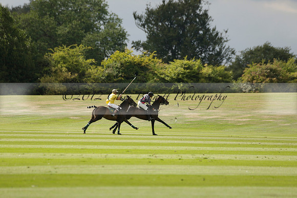 La Tremenda (lilac) v Maiz Dulce (yellow) in a Brecknock Cup polo match played on Lawns 1 at the Cowdray Park Polo Club on Tuesday 13 August 2013