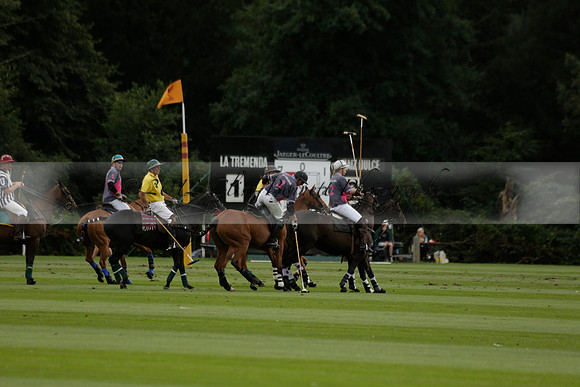 La Tremenda (lilac) v Maiz Dulce (yellow) in a Brecknock Cup polo match played on Lawns 1 at the Cowdray Park Polo Club on Tuesday 13 August 2013