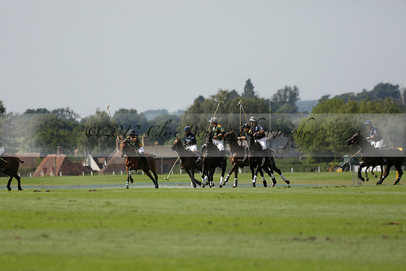 Maiz Dulce (green) v River (blue) in a Uber Polo Midsummer 12 goal polo match on Wednesday 21 August 2013 at Cowdray park Polo Club on Ambersham 2.  www.polopictures.co.uk