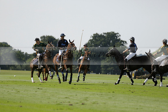 Maiz Dulce (green) v River (blue) in a Uber Polo Midsummer 12 goal polo match on Wednesday 21 August 2013 at Cowdray park Polo Club on Ambersham 2.  www.polopictures.co.uk