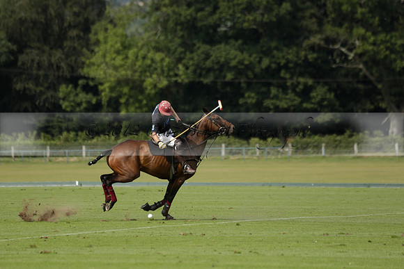 Maiz Dulce (green) v River (blue) in a Uber Polo Midsummer 12 goal polo match on Wednesday 21 August 2013 at Cowdray park Polo Club on Ambersham 2.  www.polopictures.co.uk