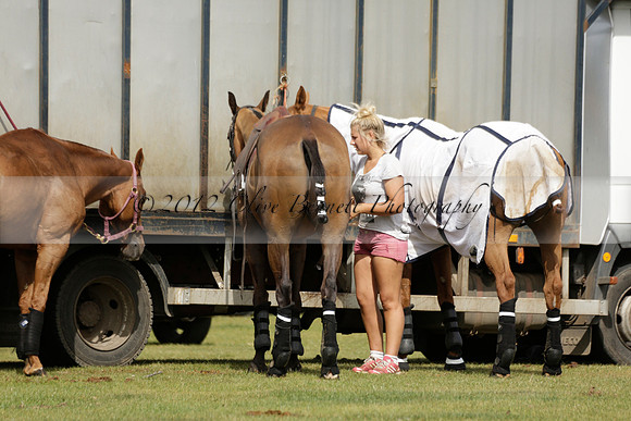 Maiz Dulce (green) v River (blue) in a Uber Polo Midsummer 12 goal polo match on Wednesday 21 August 2013 at Cowdray park Polo Club on Ambersham 2.  www.polopictures.co.uk