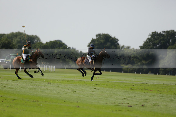 Maiz Dulce (green) v River (blue) in a Uber Polo Midsummer 12 goal polo match on Wednesday 21 August 2013 at Cowdray park Polo Club on Ambersham 2.  www.polopictures.co.uk