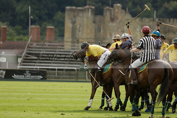 La Tremenda (lilac) v Maiz Dulce (yellow) in a Brecknock Cup polo match played on Lawns 1 at the Cowdray Park Polo Club on Tuesday 13 August 2013