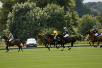 La Tremenda (lilac) v Maiz Dulce (yellow) in a Brecknock Cup polo match played on Lawns 1 at the Cowdray Park Polo Club on Tuesday 13 August 2013