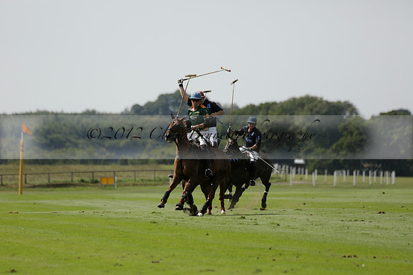 Maiz Dulce (green) v River (blue) in a Uber Polo Midsummer 12 goal polo match on Wednesday 21 August 2013 at Cowdray park Polo Club on Ambersham 2.  www.polopictures.co.uk