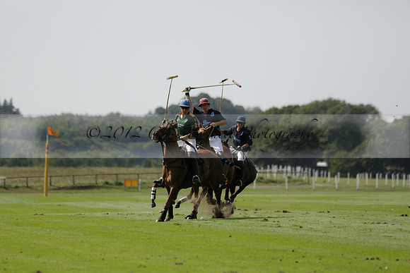 Maiz Dulce (green) v River (blue) in a Uber Polo Midsummer 12 goal polo match on Wednesday 21 August 2013 at Cowdray park Polo Club on Ambersham 2.  www.polopictures.co.uk