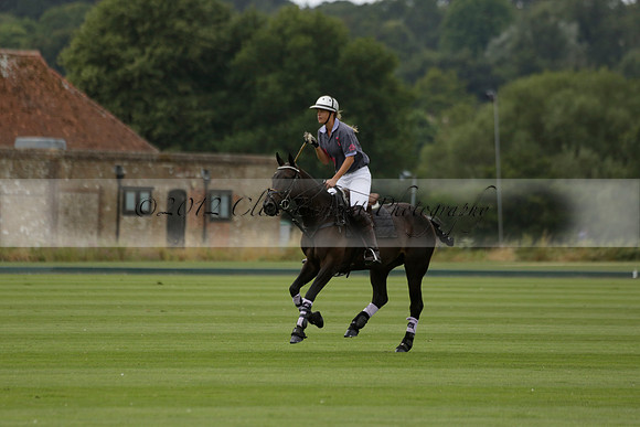 La Tremenda (lilac) v Maiz Dulce (yellow) in a Brecknock Cup polo match played on Lawns 1 at the Cowdray Park Polo Club on Tuesday 13 August 2013