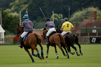 La Tremenda (lilac) v Maiz Dulce (yellow) in a Brecknock Cup polo match played on Lawns 1 at the Cowdray Park Polo Club on Tuesday 13 August 2013