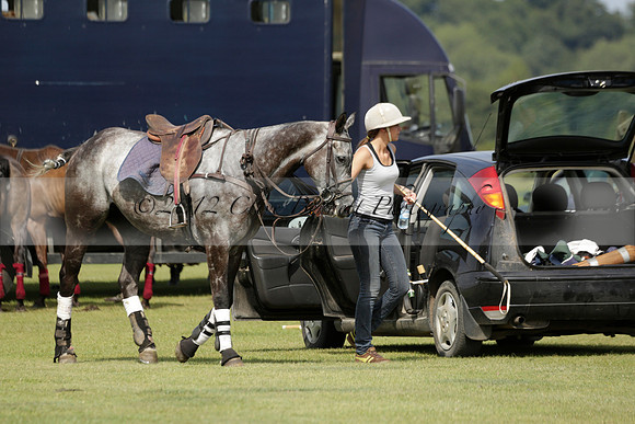 Maiz Dulce (green) v River (blue) in a Uber Polo Midsummer 12 goal polo match on Wednesday 21 August 2013 at Cowdray park Polo Club on Ambersham 2.  www.polopictures.co.uk