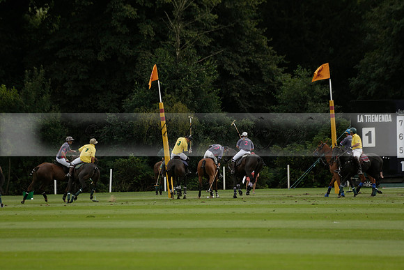 La Tremenda (lilac) v Maiz Dulce (yellow) in a Brecknock Cup polo match played on Lawns 1 at the Cowdray Park Polo Club on Tuesday 13 August 2013