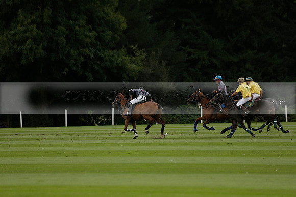 La Tremenda (lilac) v Maiz Dulce (yellow) in a Brecknock Cup polo match played on Lawns 1 at the Cowdray Park Polo Club on Tuesday 13 August 2013