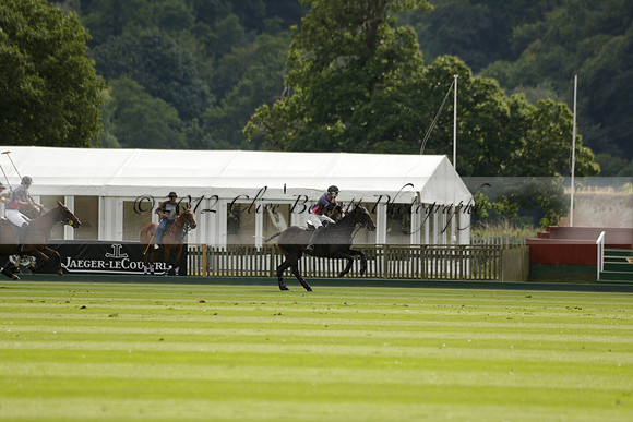 La Tremenda (lilac) v Maiz Dulce (yellow) in a Brecknock Cup polo match played on Lawns 1 at the Cowdray Park Polo Club on Tuesday 13 August 2013